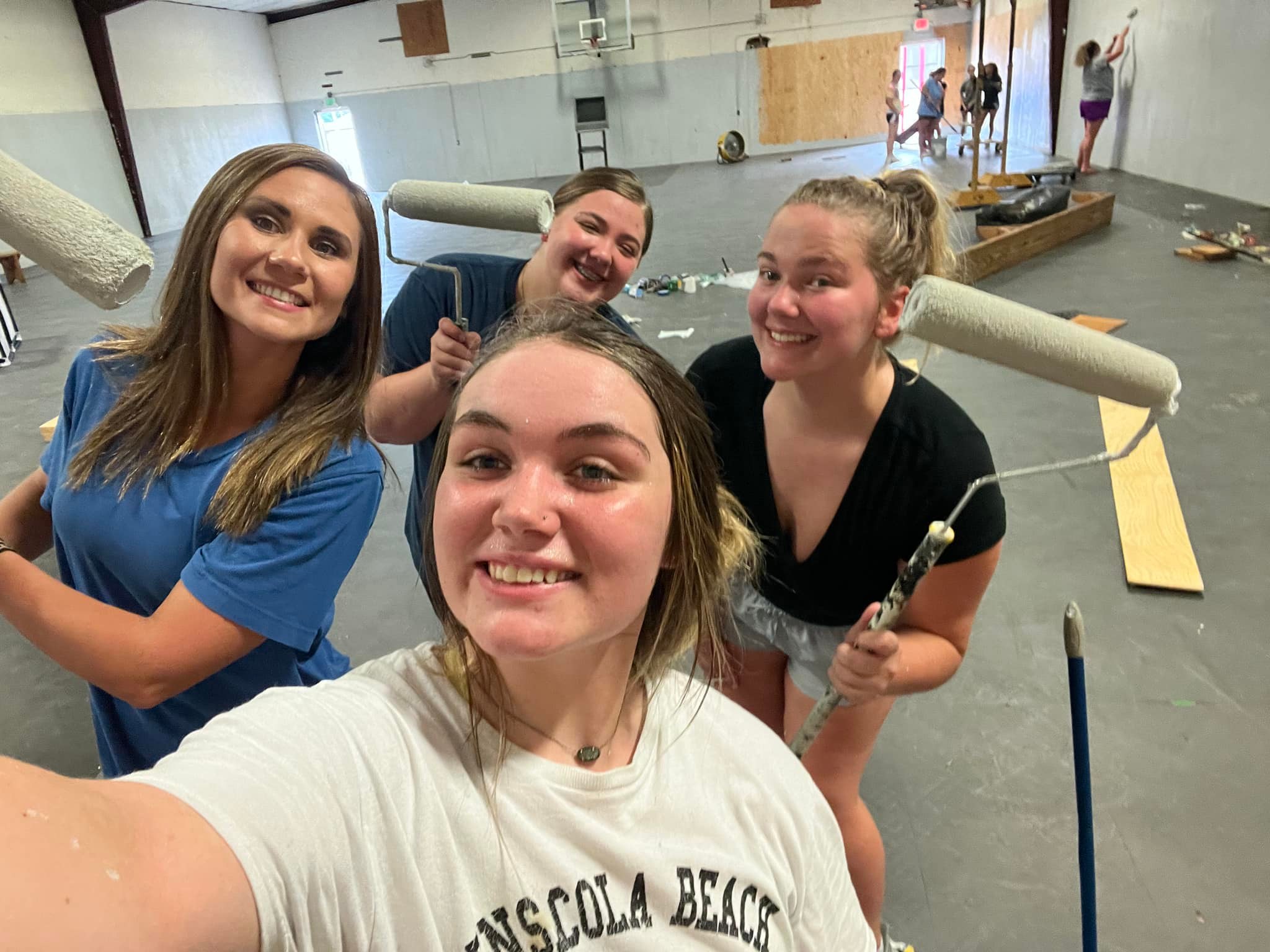 WOODVILLE HIGH SCHOOL CHEER TACKLES CAMPUS SERVICE PROJECT